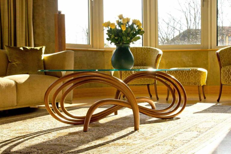 Sculptural walnut and glass coffee table