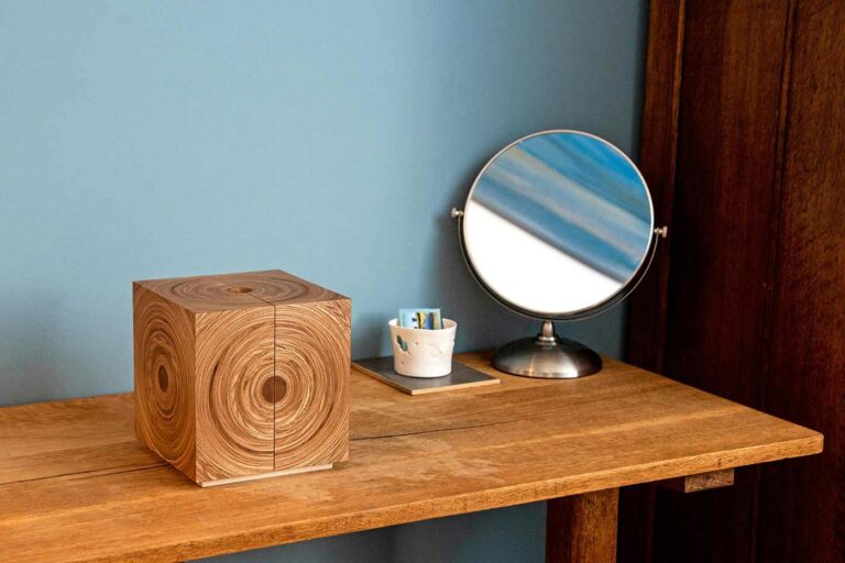 Squaring the Circle jewellery box on table next to a mirror