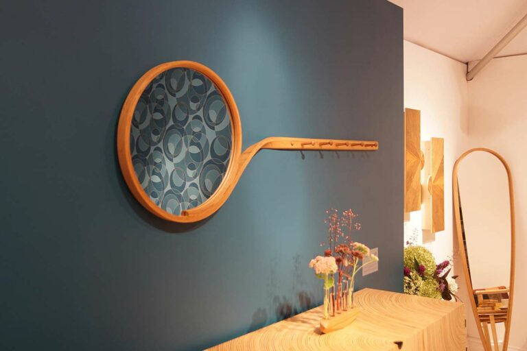 Curved steam bent mirror on wall