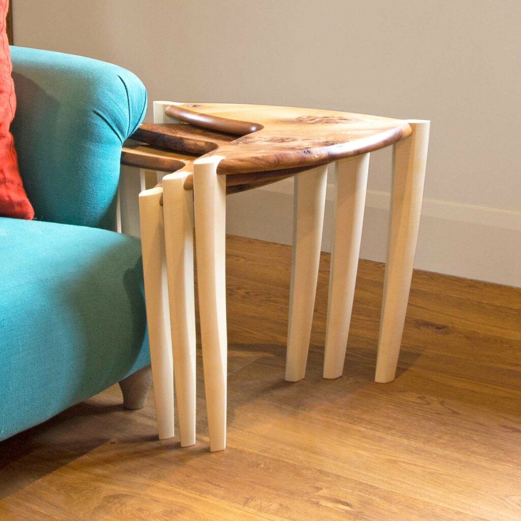 Ed, Eddy and Eddy nest of tables nest to a sofa